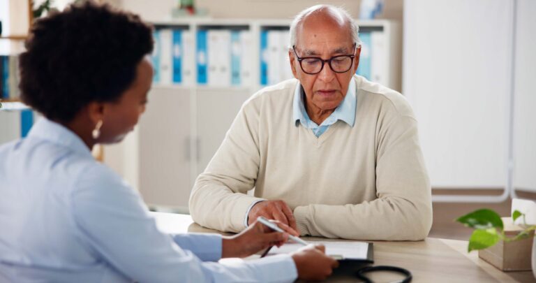 Hospital, paperwork and doctor with senior man for medical service, results and consulting. Healthcare, clinic and woman with mature patient with clipboard for medicare, insurance and prescription